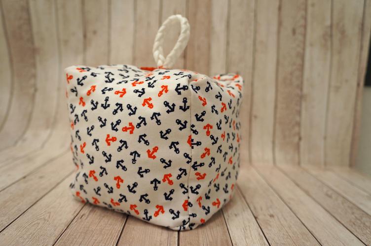 Notre cale-porte en tissu fini