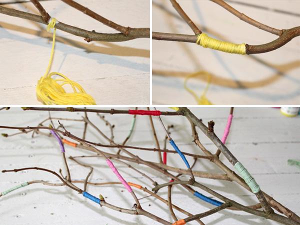 Decorating branches with colorful ribbons and thread