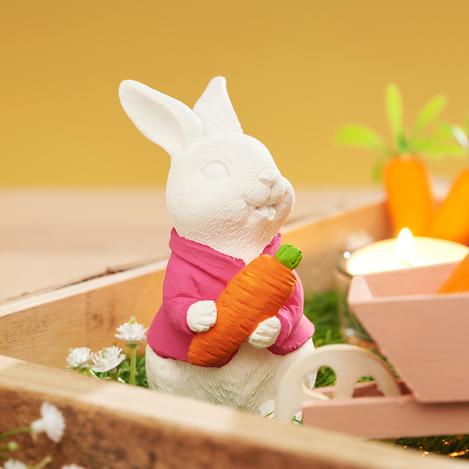 Gegossene Hasen in Miniaturlandschaft