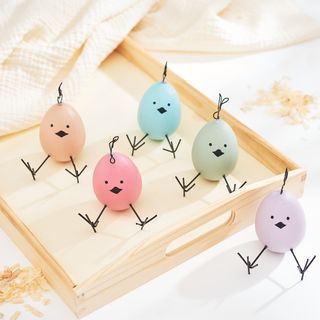Colourful chickens made from eggs